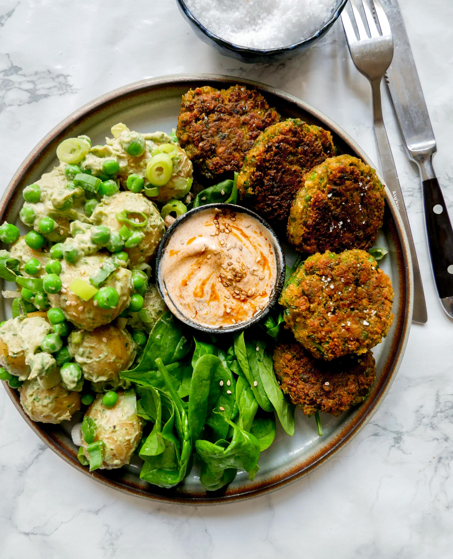 vegan bowls with potato salad and patty